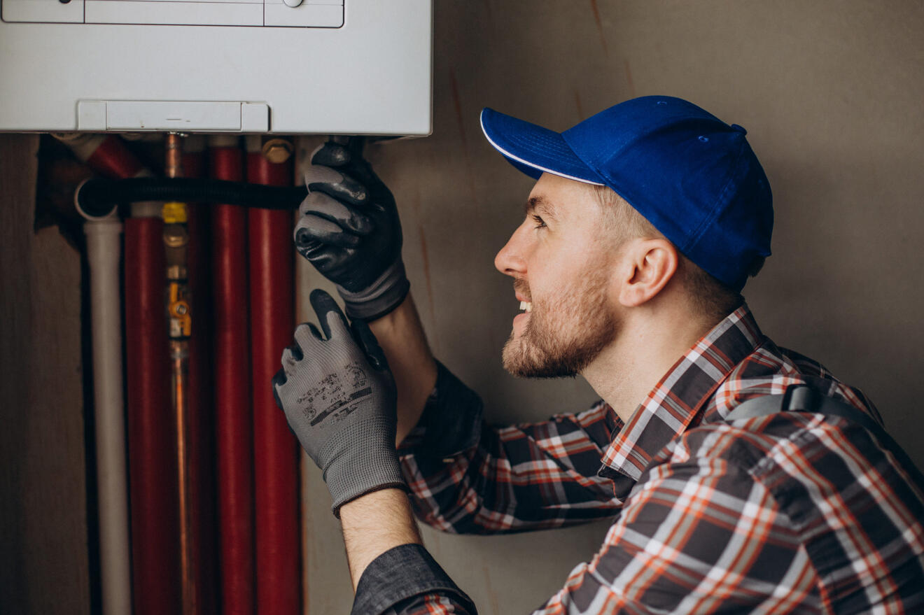 Gas Safe engineer servicing a boiler in Clapham - Clapham Heat & Flow